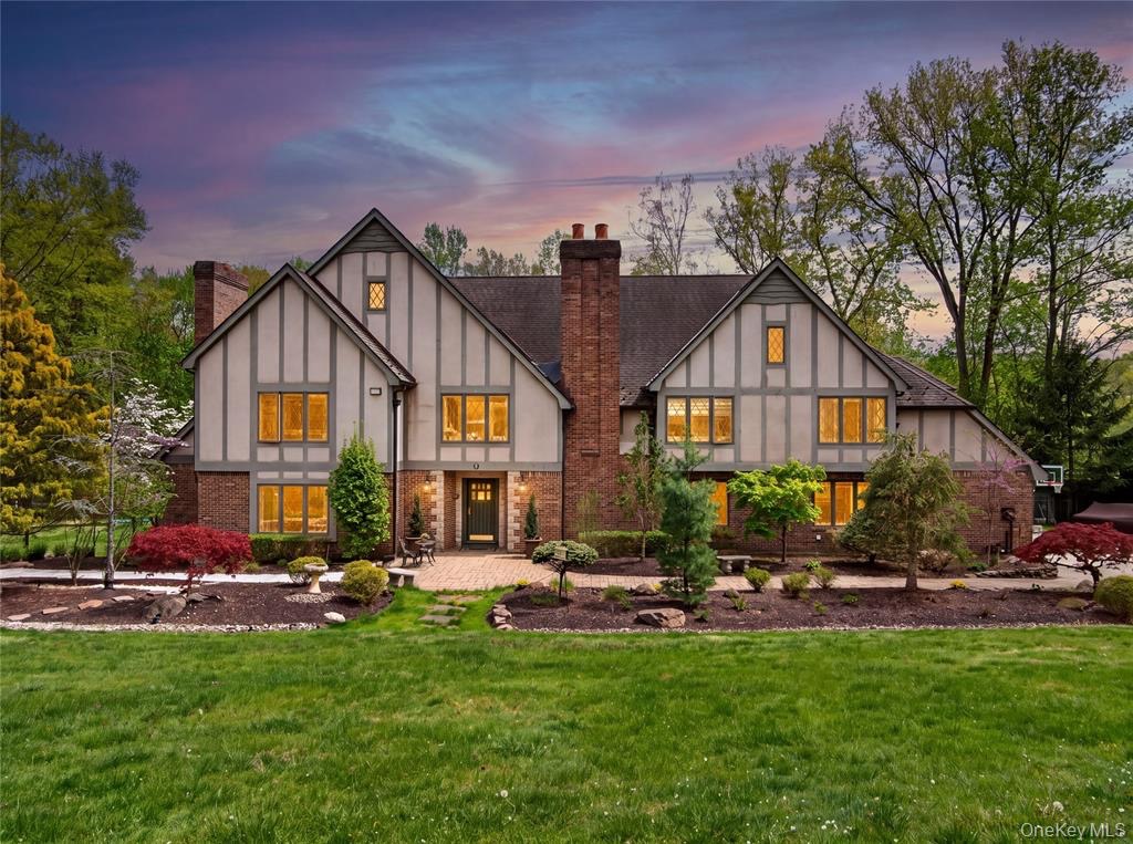 Tudor-style estate at 4 Abbey Road at dusk