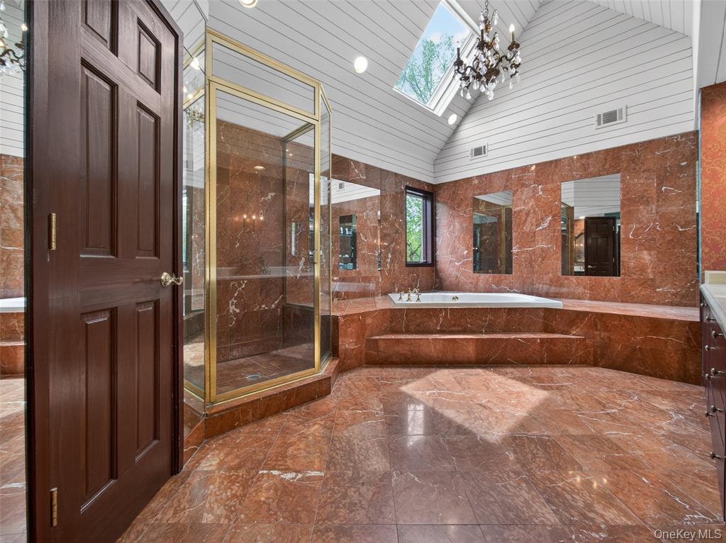 Primary bathroom with tub and shower